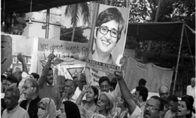 Protesters holding posters of Sabeen Mahmud