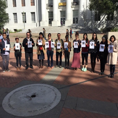 Berkeley students holding signs